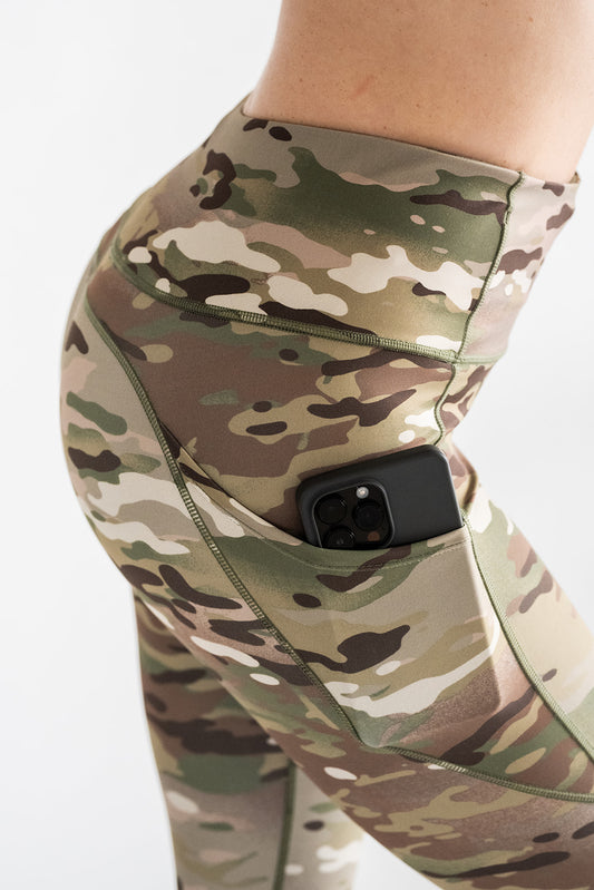 Side view of woman wearing MULTICAM Original Leggings showing high waist fit