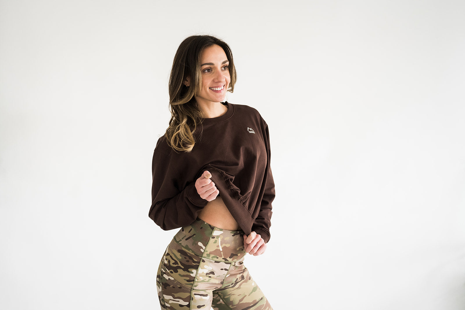 Front view of woman wearing brown Cropped Crew sweatshirt